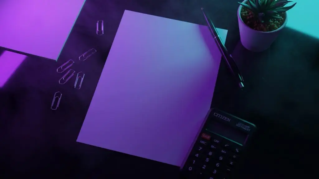 Calculating an advertising budget at a desk