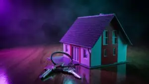 Real estate agent in front of a home for sale