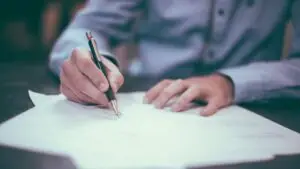 Small business owner reviewing the key clauses of a marketing agency contract before signing