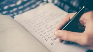 Small business owner asking a marketing agency questions during a contract meeting
