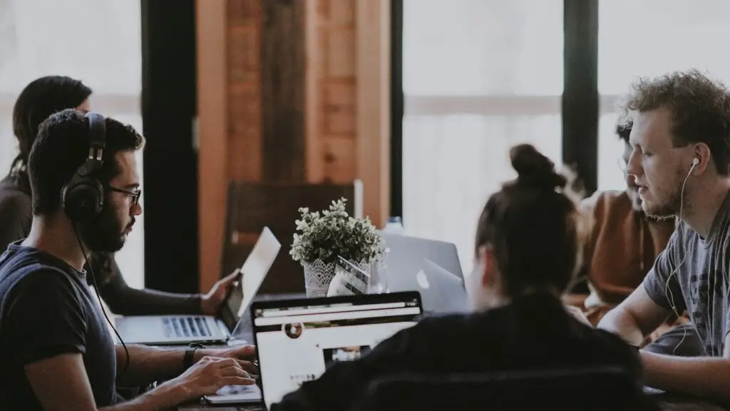 Marketing agency team reviewing daily campaign performance dashboards for a small business client