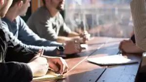 Small business owner reviewing a marketing agency retainer proposal at a desk