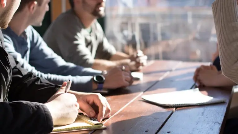 Small business owner reviewing a marketing agency retainer proposal at a desk